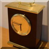 D039. Brass and wood Classics Central Missouri State University quartz clock. 6”h - $20 